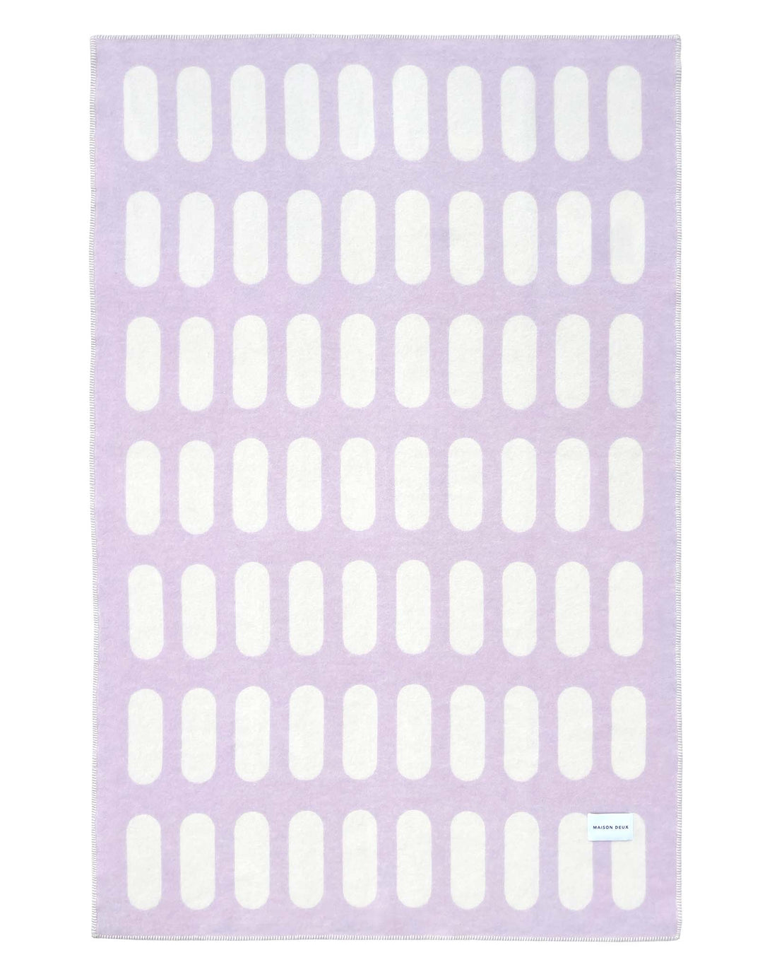 Wolldecke von Maison Deux in den Farben Lila und Weiss, Rückseite