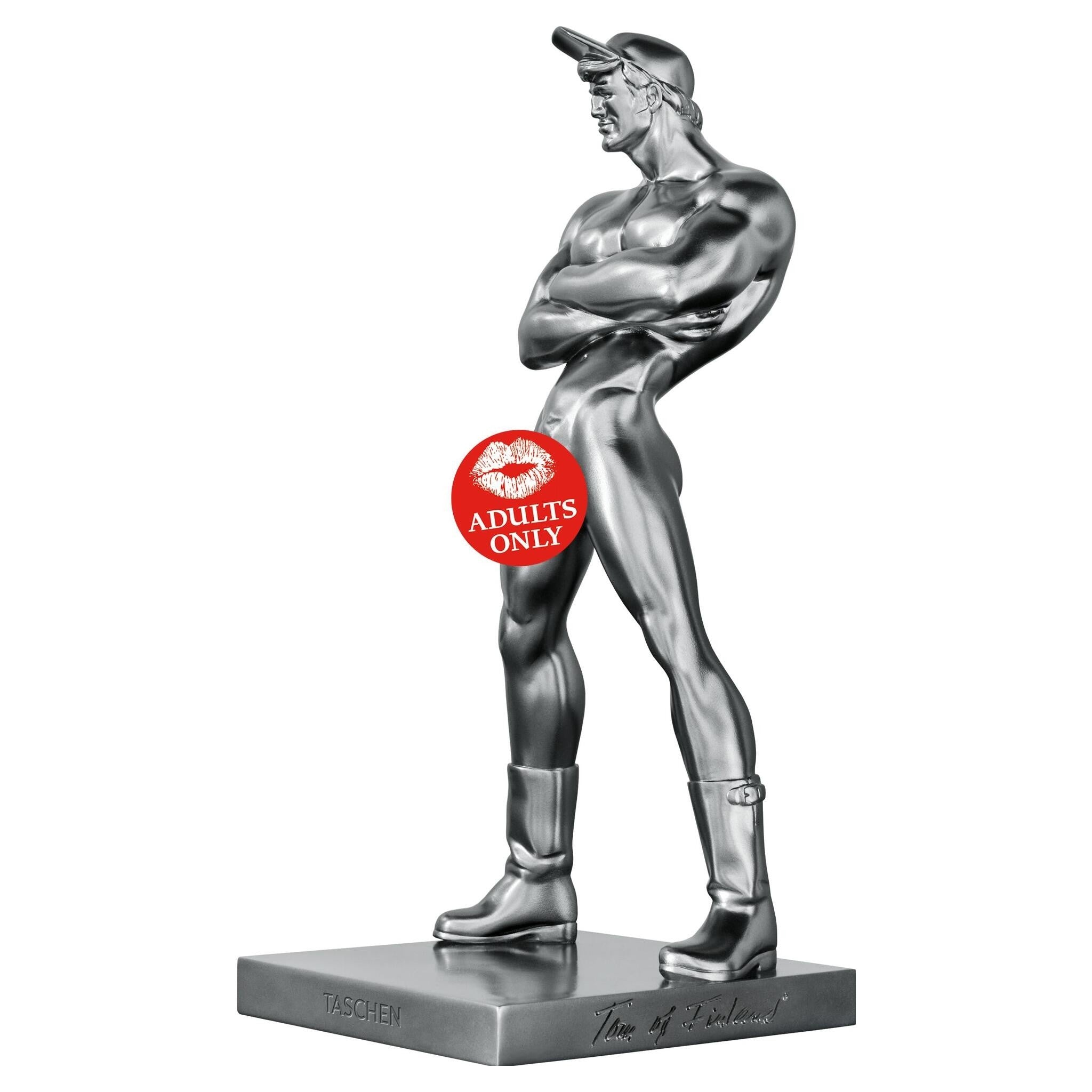 Buchstütze „Pekka“ aus silbernem Gusskunstharz auf pinkem Hintergrund