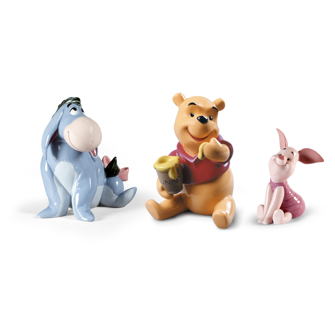 Edle Disney-Sammelfigur von Eeyore in einer sitzenden, nachdenklichen Pose.
