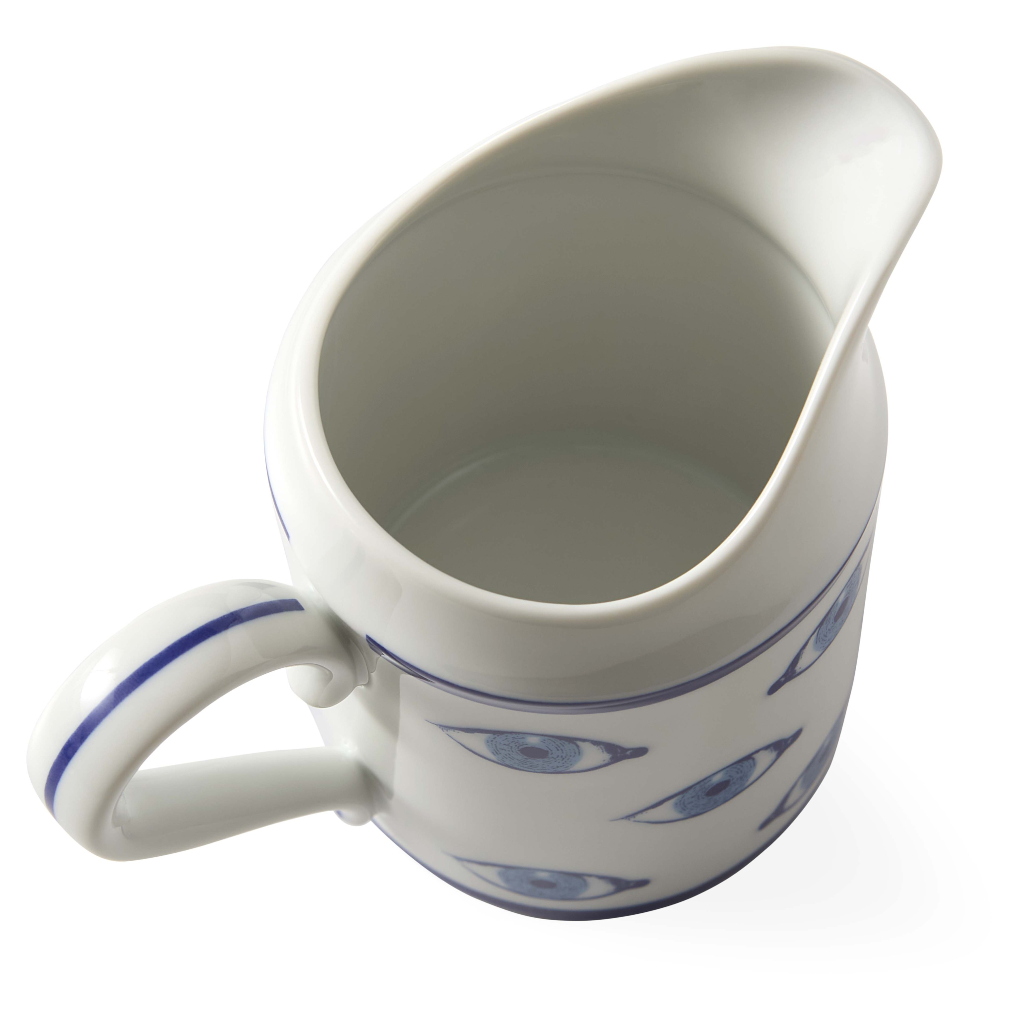 Stilvolles Porzellan-Kännchen mit surrealistischem Augenmotiv