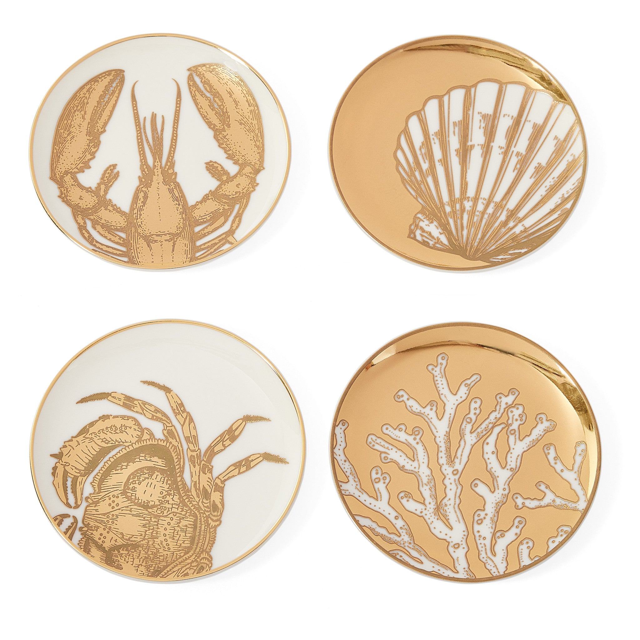 Vier Untersetzer mit goldenen Meeresmotiven auf weißem Porzellan
