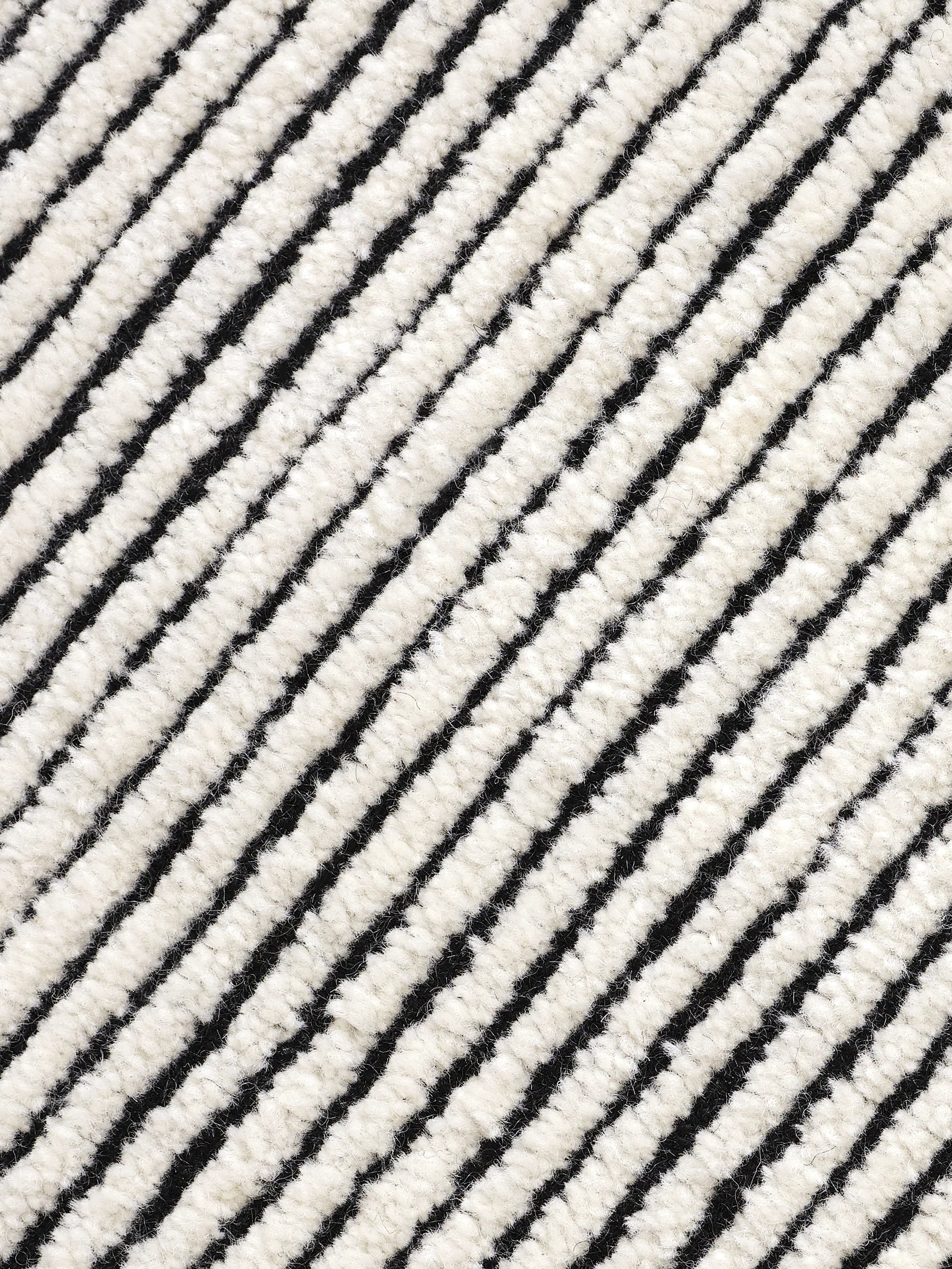 Disc Rug Black White Design markanter Teppich mit kontrastreichem Farbdesign aus Wolle und Baumwolle