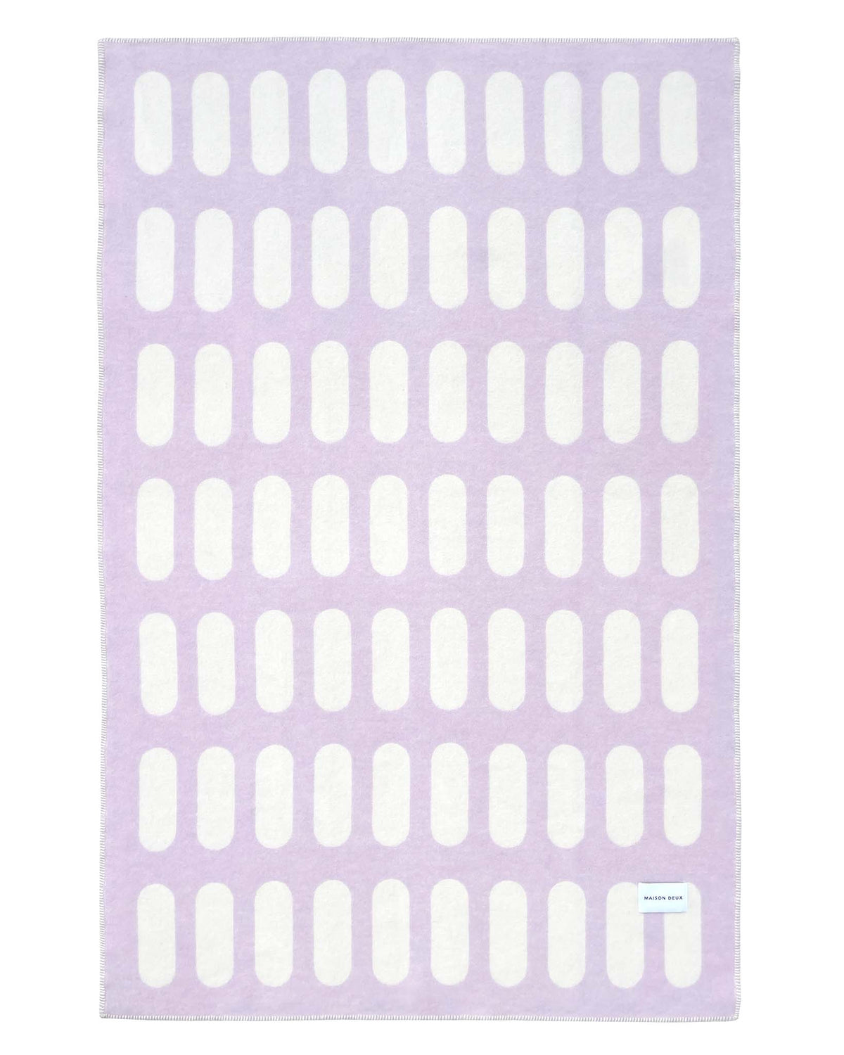 Wolldecke von Maison Deux in den Farben Lila und Weiss, Rückseite