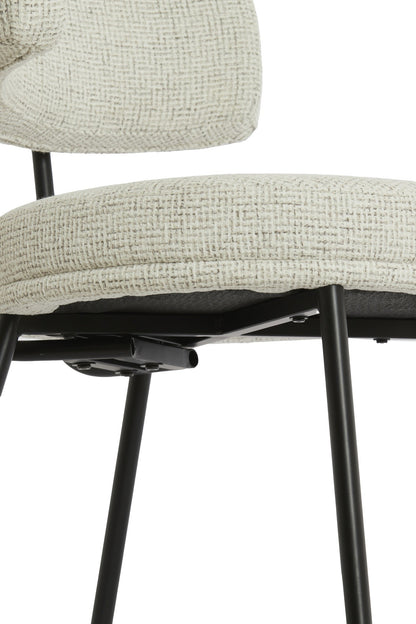 Stuhl mit cremefarbenem Stoff und schwarzem Gestell