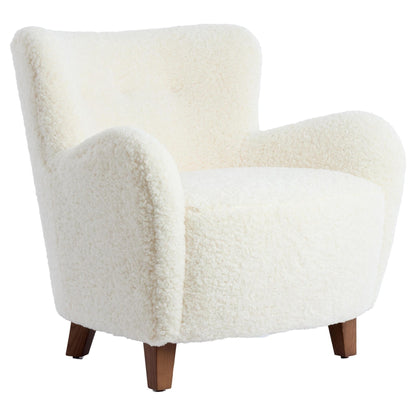 Polsterstuhl VREYA mit cremefarbenem Furry-Bezug und dunklen Holzbeinen