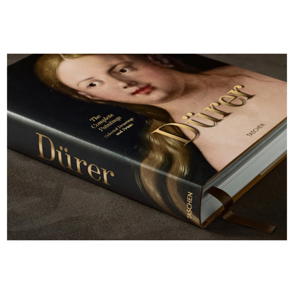 Künstlermonografie mit Porträt und Goldschrift.