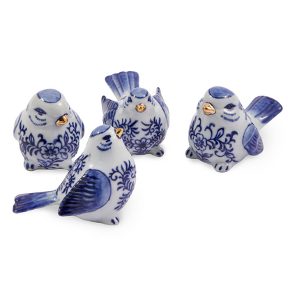 Vier blaue Porzellanvögel mit goldenen Details im Set
